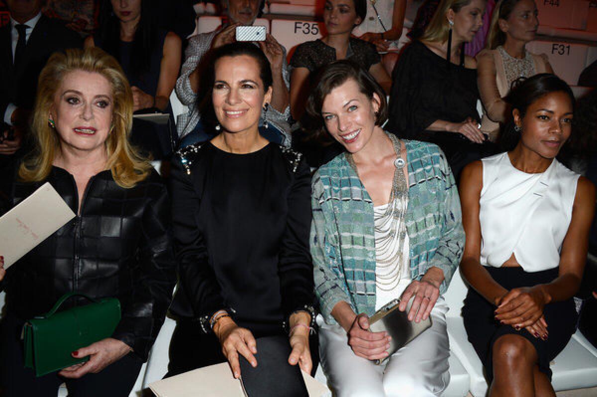 Catherine Deneuve, left, Roberta Armani, Milla Jovovich and Naomie Harris attend the Giorgio Armani Prive show on Tuesday during Paris Fashion Week Haute-Couture Fall/Winter 2013-2014.