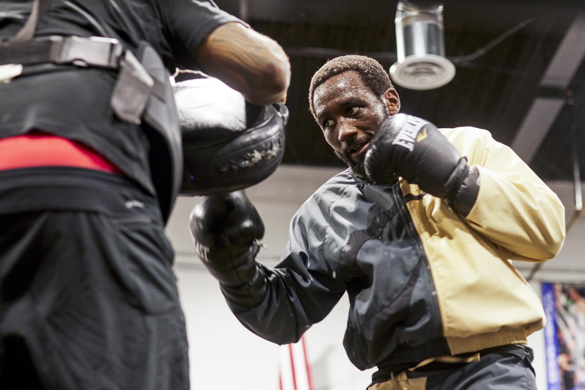 Terence 'Bud' Crawford punches pads during a training session at the Triple Threat Boxing Gym in Colorado Springs, Colo. 