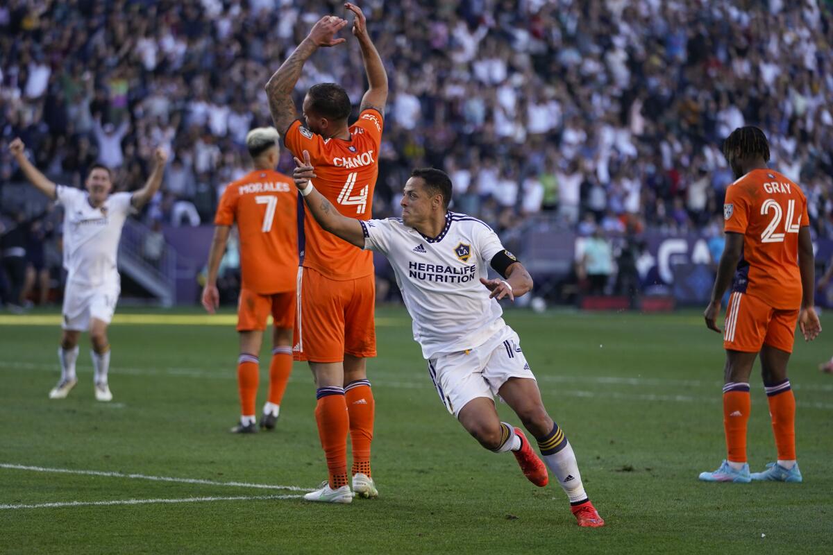 Galaxy forward Javier "Chicharito" Hernández celebrates in front of New York City FC's Maxime Chanot.