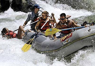 Rafters negotiate a class III rapid on the South Fork of the American River.