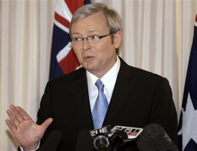 FILE - In this Nov. 25, 2007 file photo is the then newly-elected Australian Prime Minister Kevin Rudd gesturing during a press conference in Brisbane, Australia. Prime Minister Rudd admits he has a reputation as a nerd _ but he doesn't seem to mind. The buttoned-down, bespectacled leader whose lofty rhetoric and slight stiffness in public sometimes give him the aura of a schoolteacher was asked on radio Wednesday, April 8, 2009, how he would spend a cash payout the government is handing out to most Australians. "Some people have accused me of being a nerd from central casting," Rudd replied during a talk radio segment on the youth station Nova. (AP Photo/Rob Griffith, File)