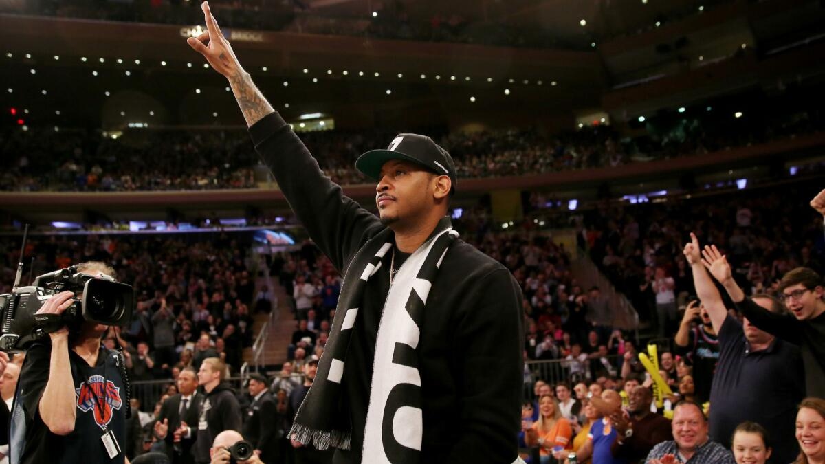 Carmelo Anthony waves to the fans at Madison Square Garden during the first quarter of a game between the Knicks and Heat on Jan. 27.