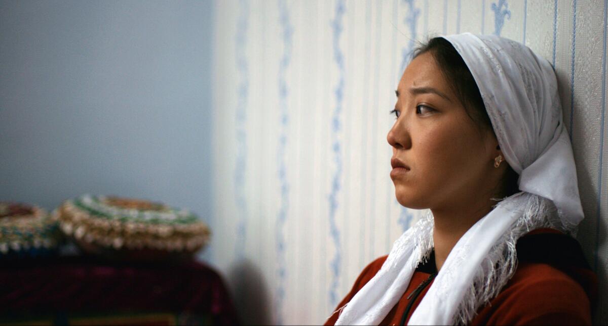 A sad young Kyrgyz woman in"Ala Kachuu — Take and Run." 