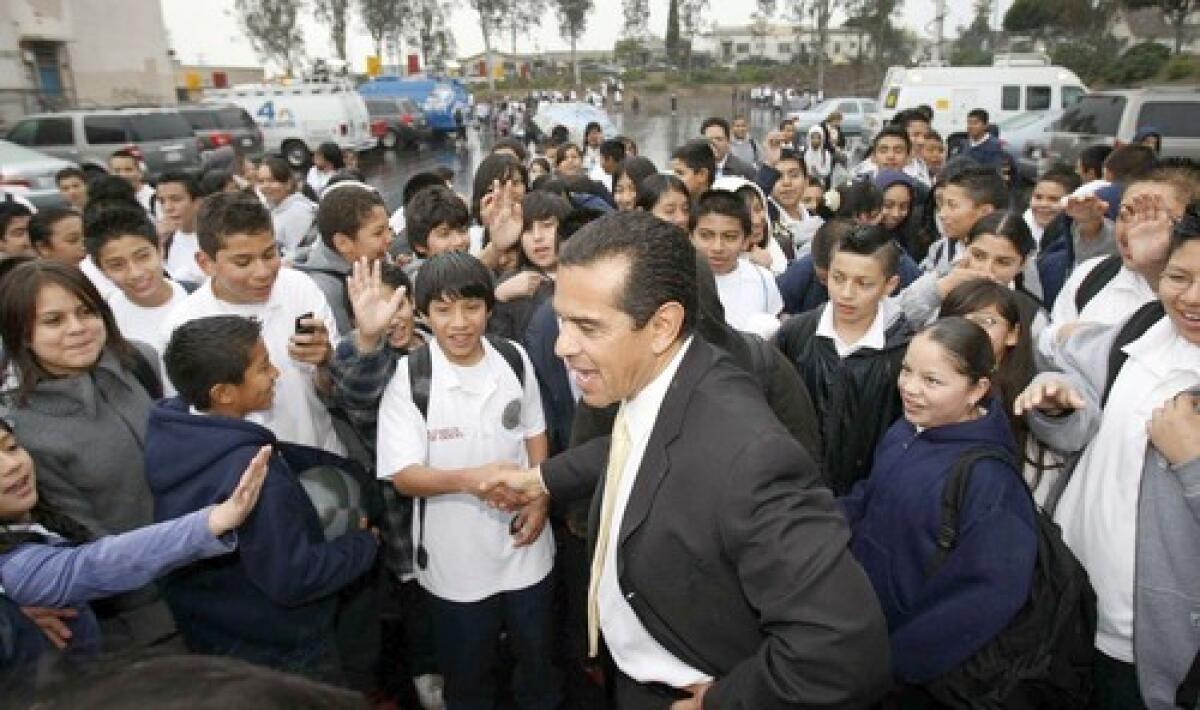 Students at Hollenbeck Middle School in Los Angeles greet Mayor Antonio Villaraigosa the day after he was elected to a second term as mayor. He was meeting with parents to discuss his education goals.