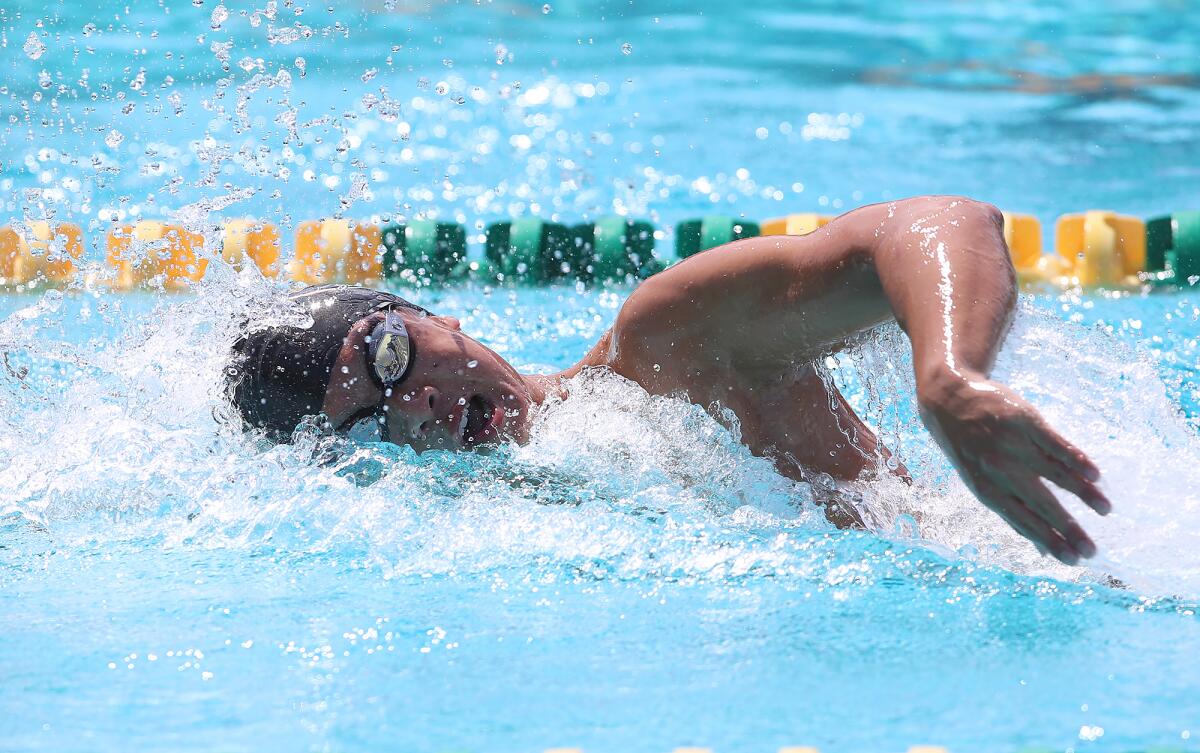 Fountain Valley's Peter Vu swims to victory in the 200 freestyle during Thursday's meet.