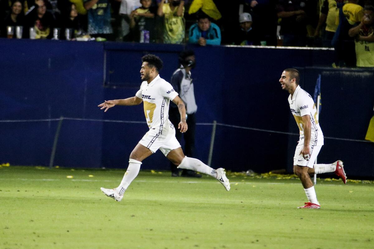 Pumas' Rogerio, right, and Alek Álvarez 