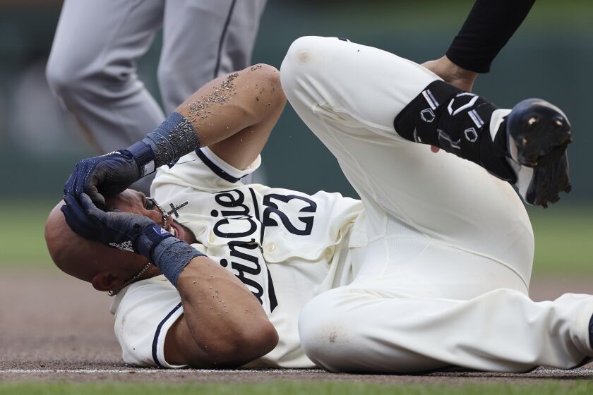 Minnesota Twins' Royce Lewis reacts after colliding with Cleveland Guardians first baseman Gabriel Arias during the eighth inning of a baseball game, Sunday, June 4, 2023, in Minneapolis. (AP Photo/Stacy Bengs)