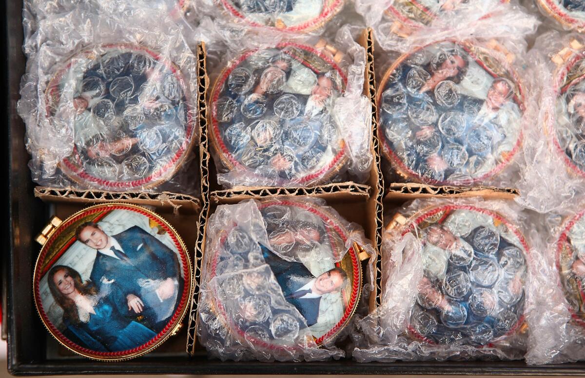 March 31, 2011: Royal Wedding souvenir pill boxes featuring Prince William and Kate Middleton are displayed in London.