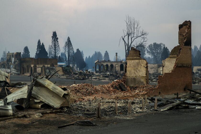 GREENVILLE, CA - AUGUST 08, 2021: The Sincerity Lodge, foreground, on Main St. in Greenville was destroyed by the Dixie Fire. (Mel Melcon / Los Angeles Times)