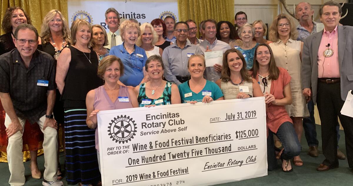 The 16th Annual Encinitas Rotary Wine & Food Festival benefactors at the July 31 Encinitas Rotary Club check presentation.