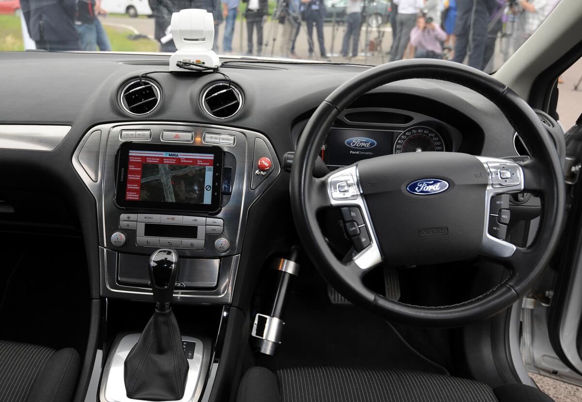 The interior of a driverless car is shown at the headquarters of motor industry research organization MIRA at Nuneaton in the West Midlands, England.