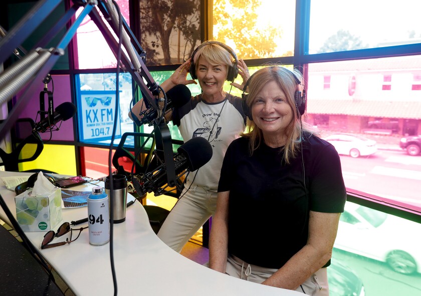 Barbara McMurray, left, and Laguna Beach Mayor Sue Kempf host a show for the KX Takeover fundraiser event.