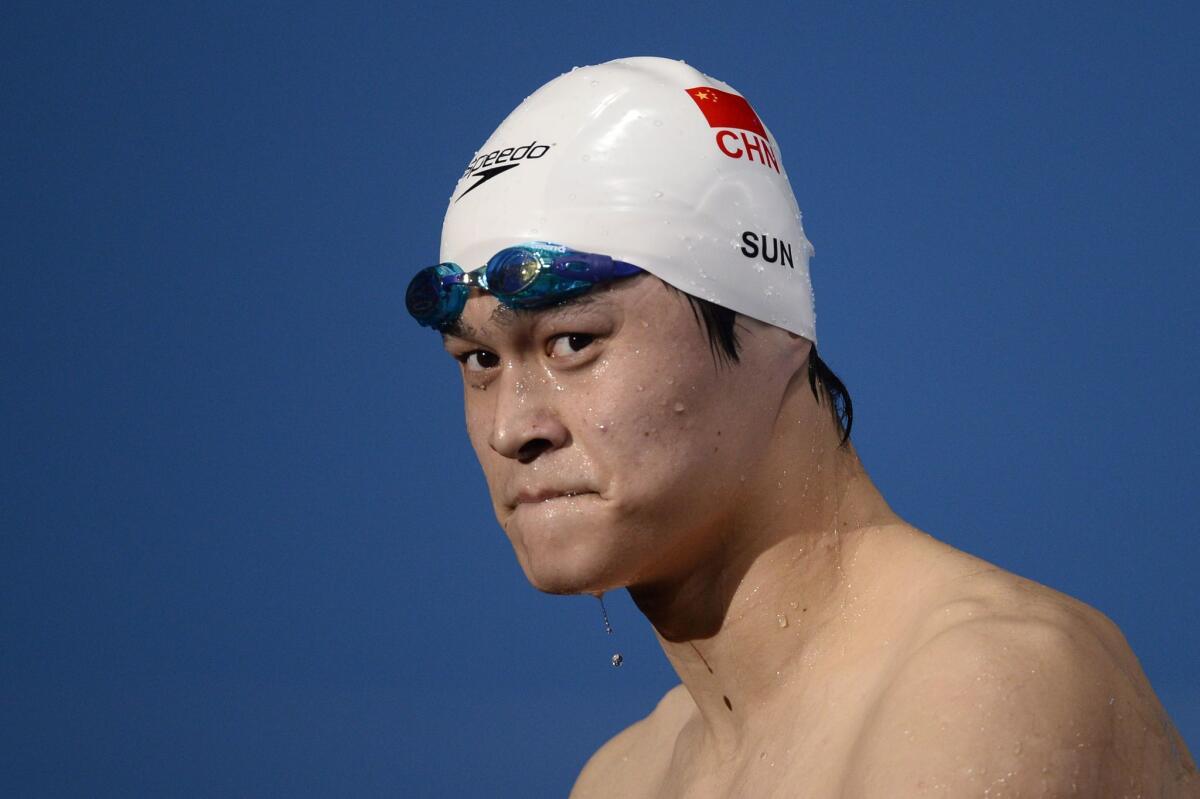 China's Sun Yang, shown in August 2013, was banned from swimming for three months last summer after a positive doping test.