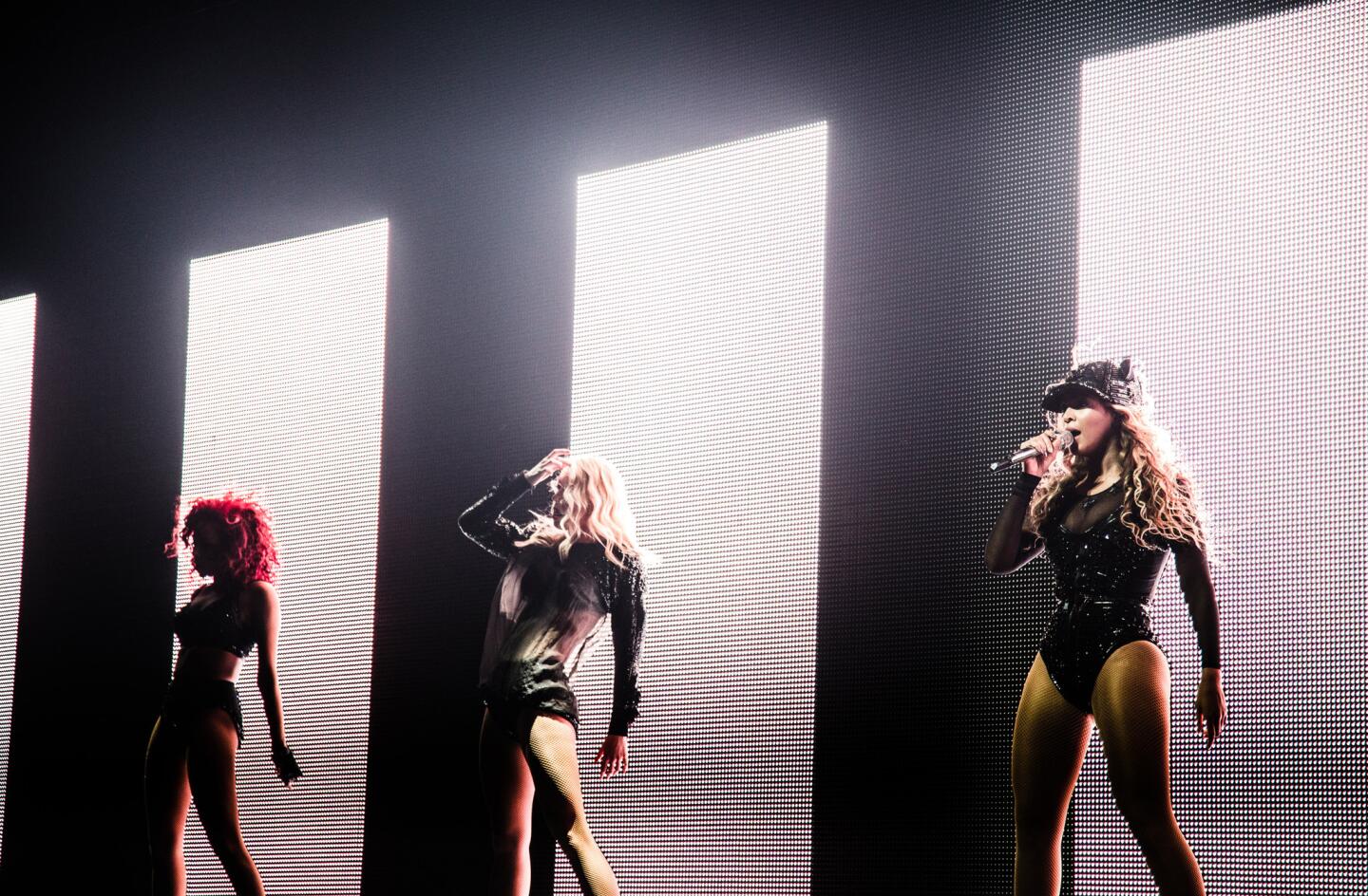 Beyonce, right, performs at the BB&T Center in Fort Lauderdale, Fla., during her "Mrs. Carter Show World Tour 2013."