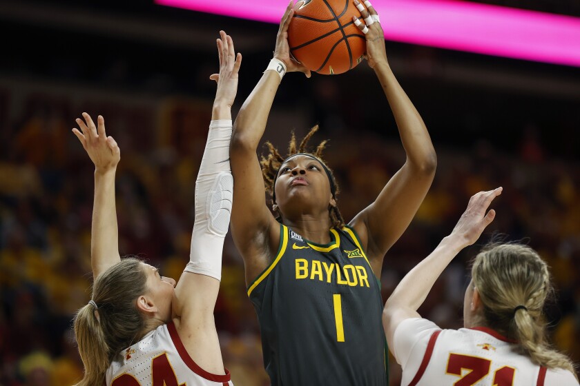 FILE - Baylor forward NaLyssa Smith (1) shoots over Iowa State guard Ashley Joens (24) and forward Morgan Kane (31) during the first half of an NCAA college basketball game Monday, Feb. 28, 2022, in Ames, Iowa. NaLyssa Smith was a unanimous choice for the Associated Press All-America team announced Wednesday, March 16, 2022.(AP Photo/Matthew Putney, File)