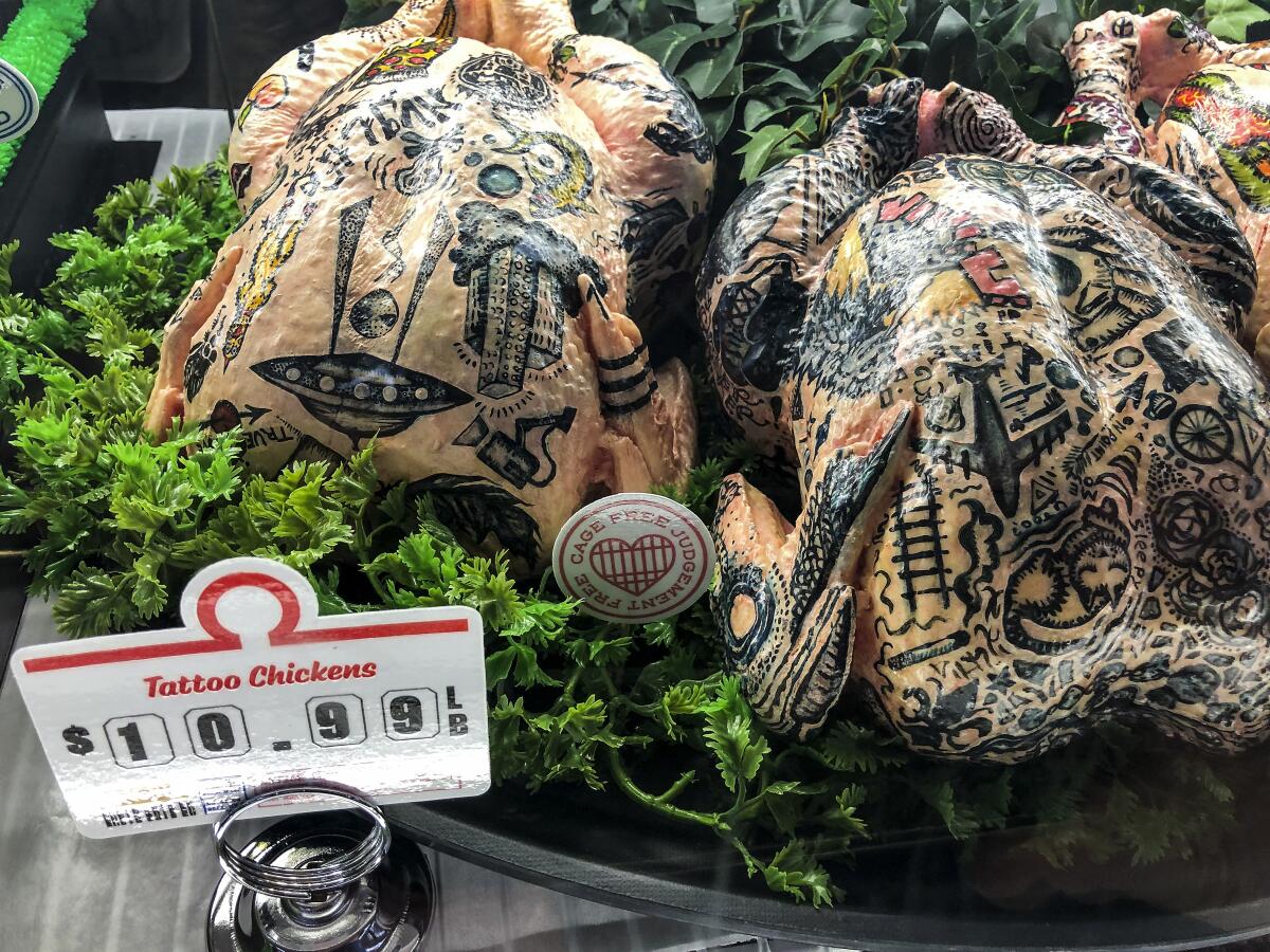 Tattooed raw chickens at Meow Wolf's MegaMart