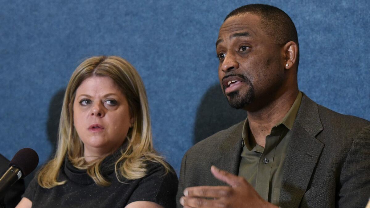 Diane Gross and Khalid Pitts, owners of Cork Wine Bar, take part in a news conference about their lawsuit against President Trump over his Washington hotel on Thurssday.