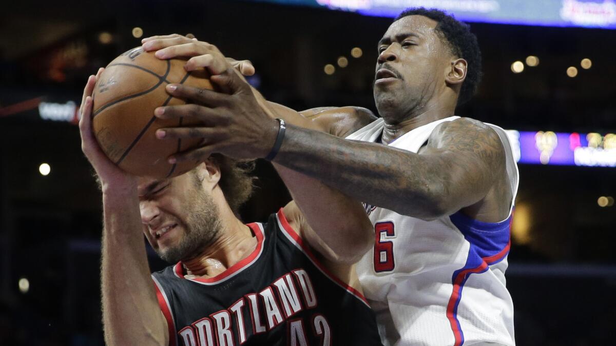 Portland Trail Blazers center Robin Lopez battles for a rebound with Clippers center DeAndre Jordan during a game at Staples Center on Nov. 8, 2014.