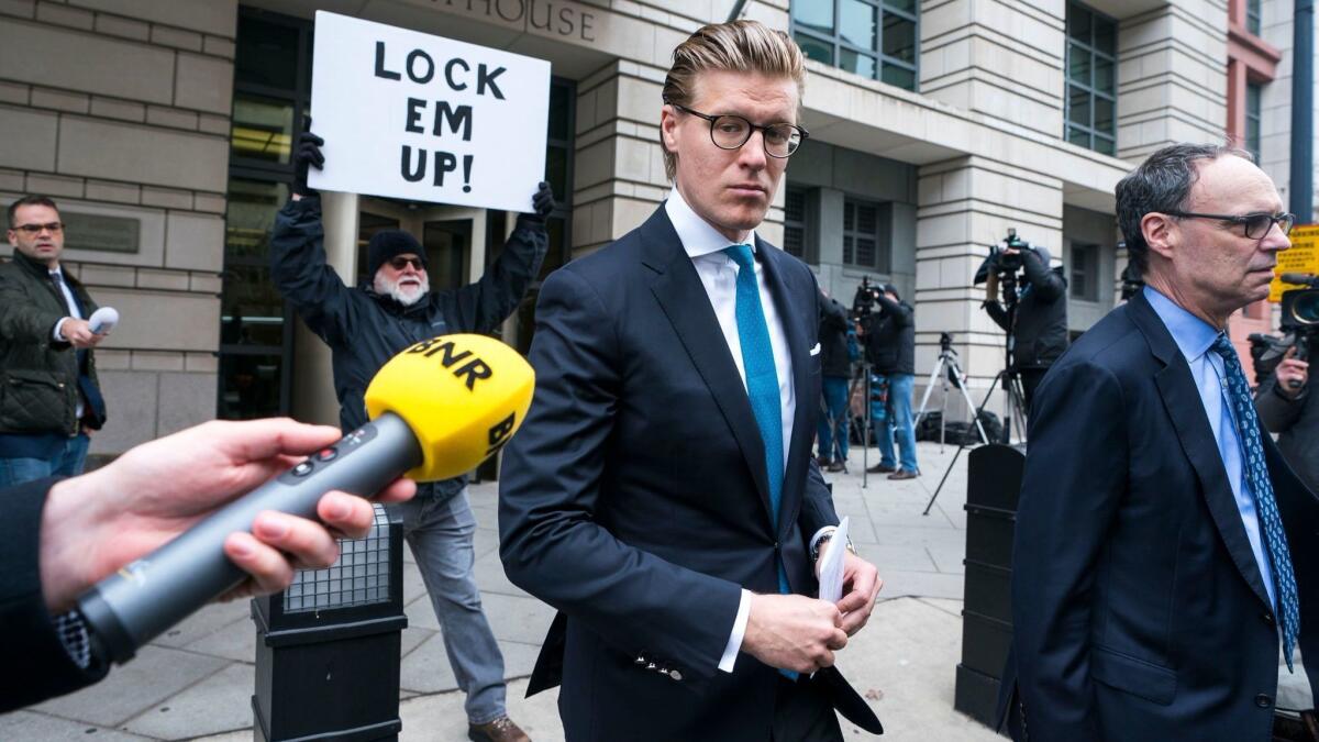 Alex van der Zwaan walks out of the federal courthouse in Washington after being sentenced to 30 days in prison for making false statements to investigators. He is the first person to be sentenced in the Russia probe.