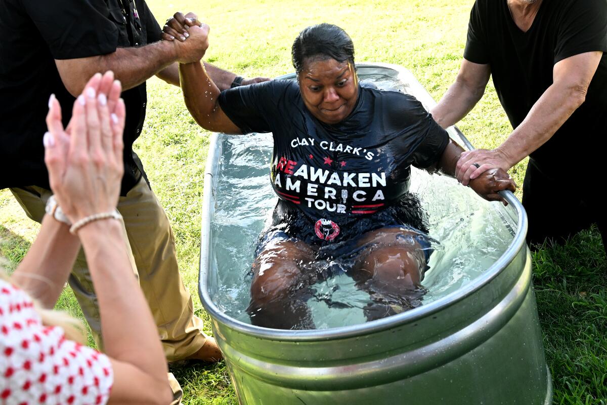 An attendee gets baptized.