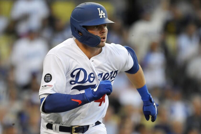 Los Angeles Dodgers' Gavin Lux runs to first as he hits a double during the third inning of a baseball game against the Colorado Rockies Monday, Sept. 2, 2019, in Los Angeles. (AP Photo/Mark J. Terrill)
