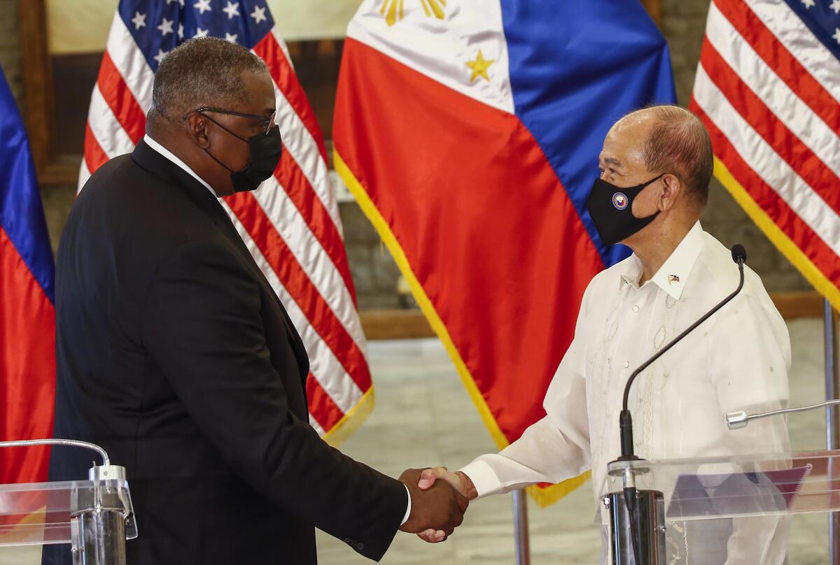 U.S. Defense Secretary Lloyd Austin, left, and Philippines Defense Secretary Delfin Lorenzana