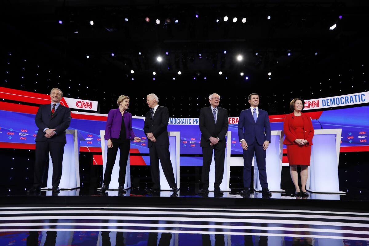 Democratic presidential candidates before a primary debate 