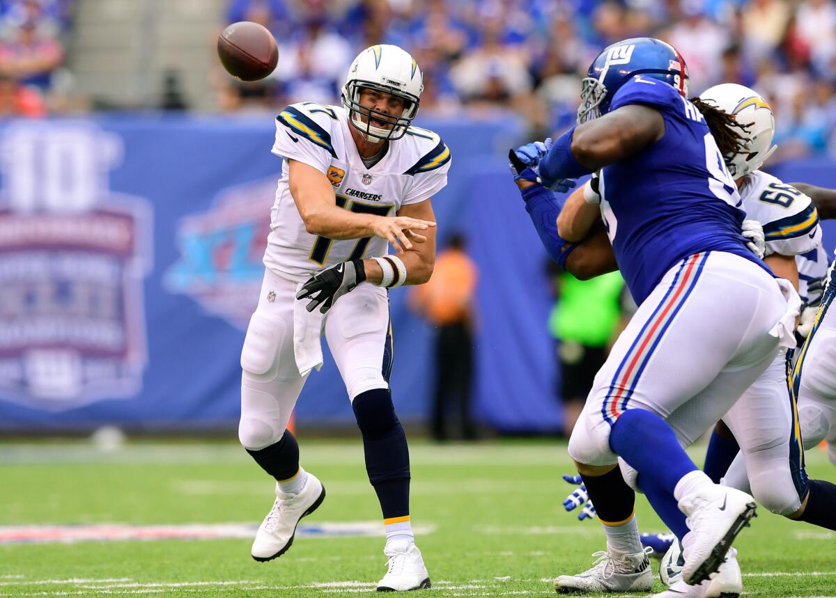 Chargers quarterback Philip Rivers gets off a pass against the Giants during the second quarter of Sunday's game.