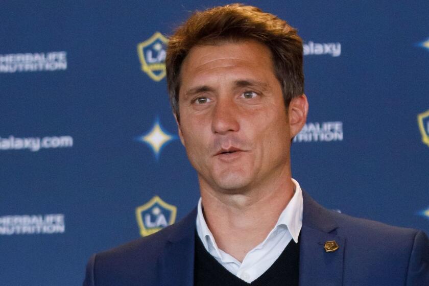 Mandatory Credit: Photo by EUGENE GARCIA/EPA-EFE/REX (10047396a) New Los Angeles Galaxy soccer head coach Guillermo Barros Schelotto holds up a team jersey during a press conference at the Dignity Health Sports Park in Carson, California, USA, 03 January 2019. Schelotto is a former Argentine national team player and manager of Argentine club teams. Argentine Guillermo Barros Schelotto named LA Galaxy head coach, Carson, USA - 03 Jan 2019 ** Usable by LA, CT and MoD ONLY **