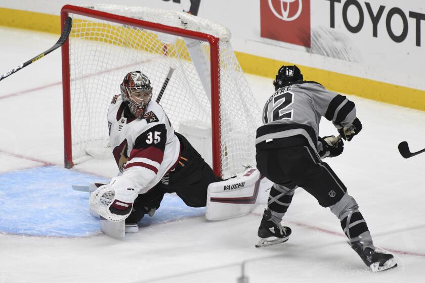 Coyotes goalie Darcy Kuemper defends against the Kings' Trevor Moore during the second period April 24, 2021.