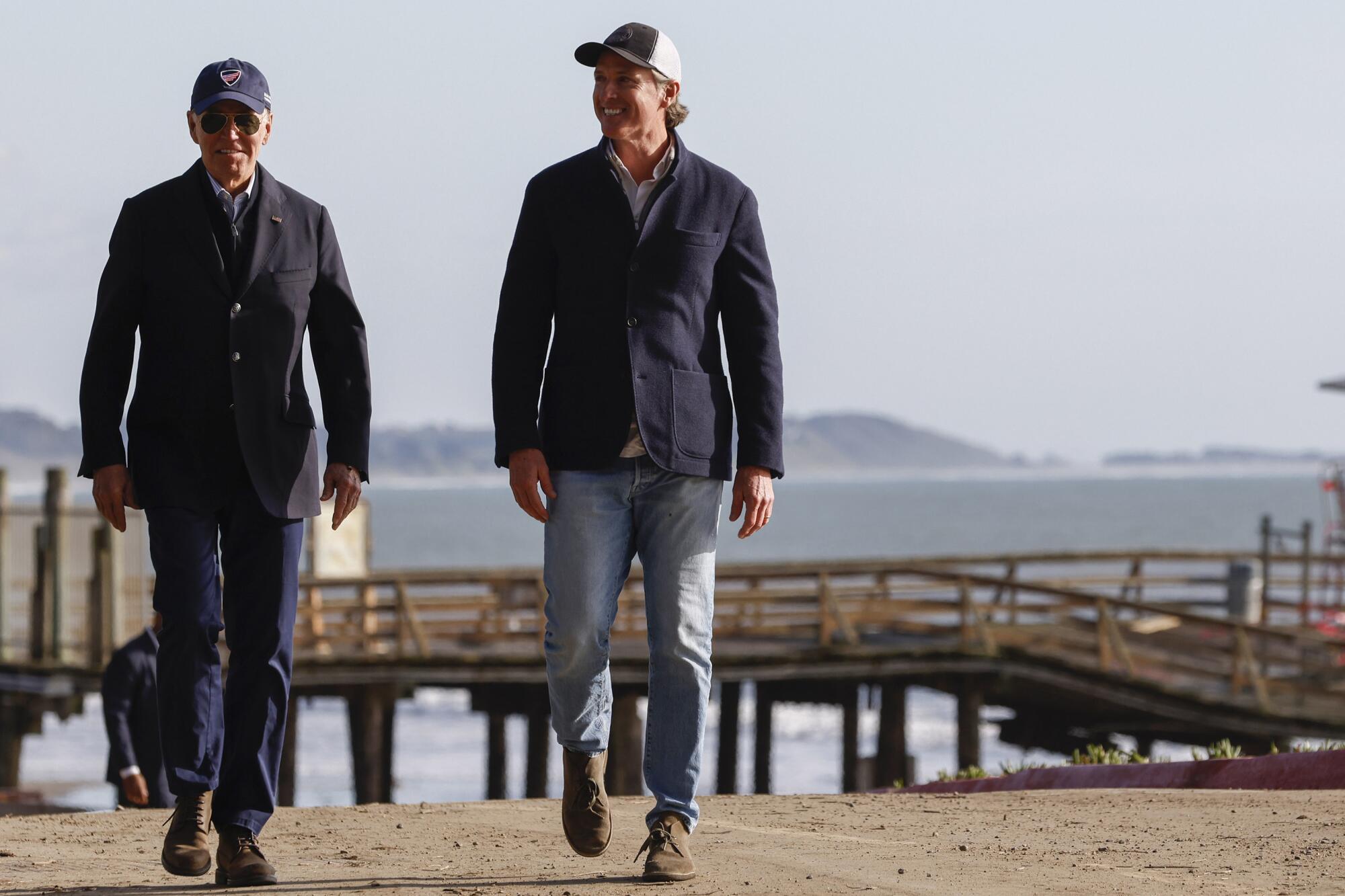 President Biden and Gov. Gavin Newsom on the beach in Seacliff, Calif.