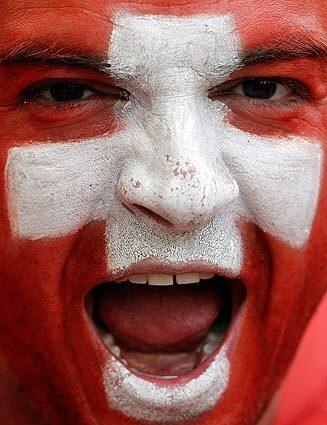 A Swiss fan wears a patriotic expression before the Spain-Switzerland game in Durban, South Africa. Switzerland won in an upset, ending Spain's 12-game streak of wins.