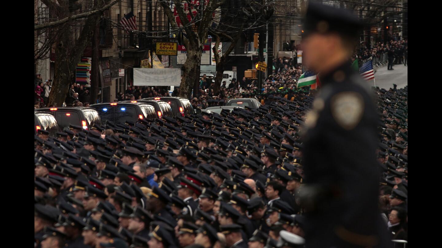 A sea of uniformed officers line the street in honor of police Officer Wenjian Liu, who was killed with partner Rafael Ramos on Dec. 20.