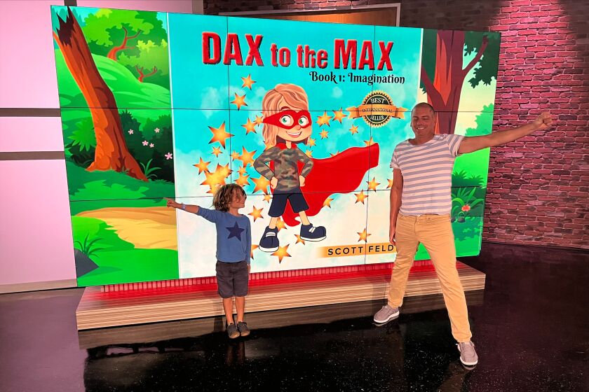 Dax with his dad Scott Feld on Fox 5 News.