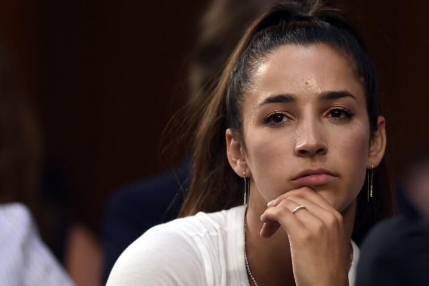 Olympic gold medalist Aly Raisman listens to testimony during a Senate Commerce subcommittee hearing on "Strengthening and Empowering U.S. Amateur Athletes," on Capitol Hill in Washington, Tuesday, July 24, 2018. (AP Photo/Susan Walsh)