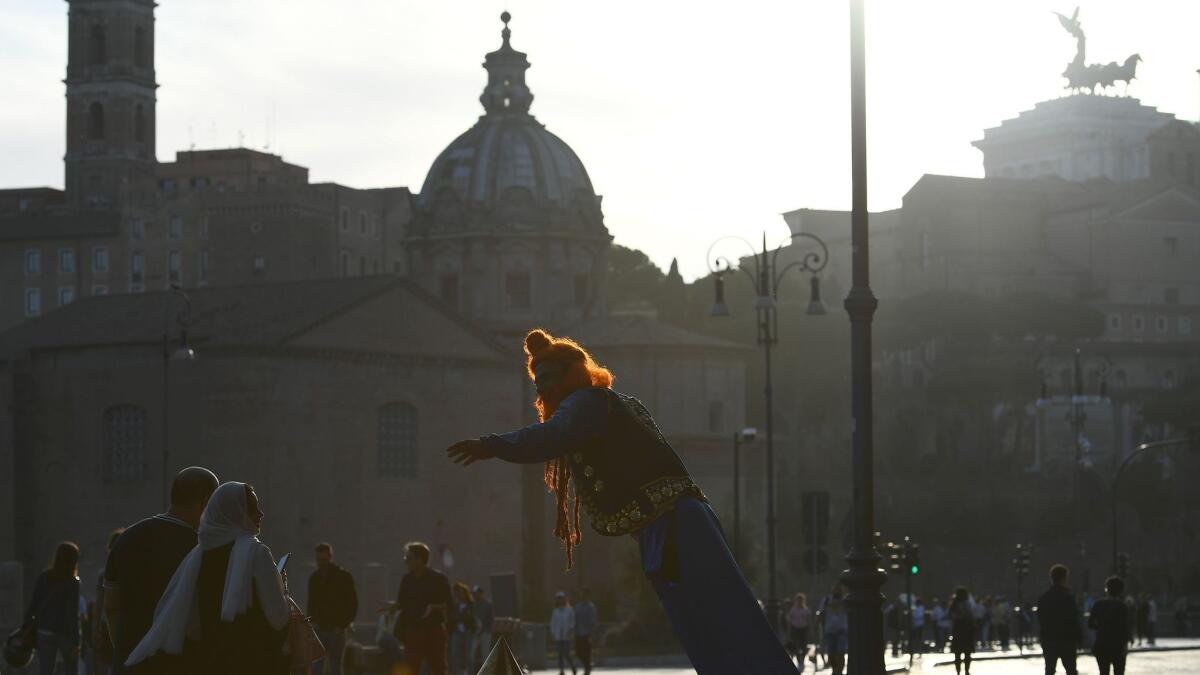 A street artist poses as Aladdin in Rome, selected the world's No. 1 destination.