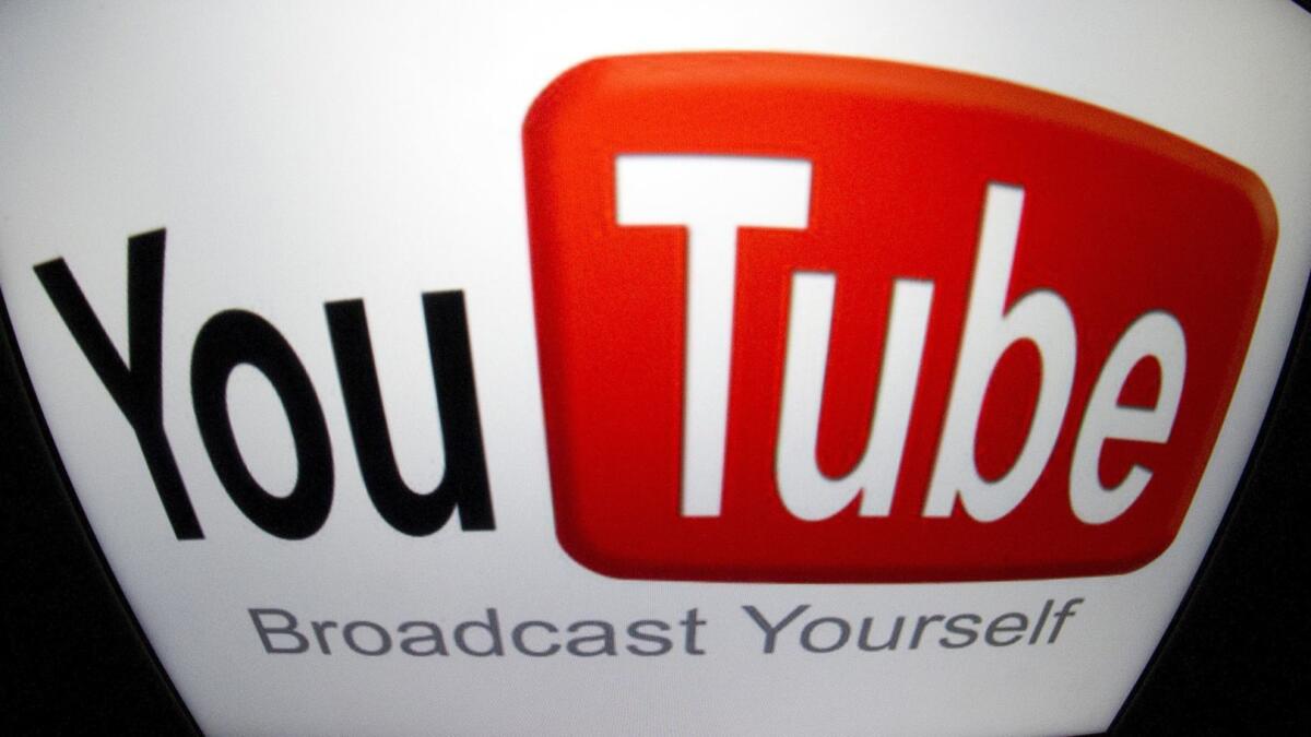 The YouTube logo is seen on a tablet screen on Dec. 4, 2012 in Paris.
