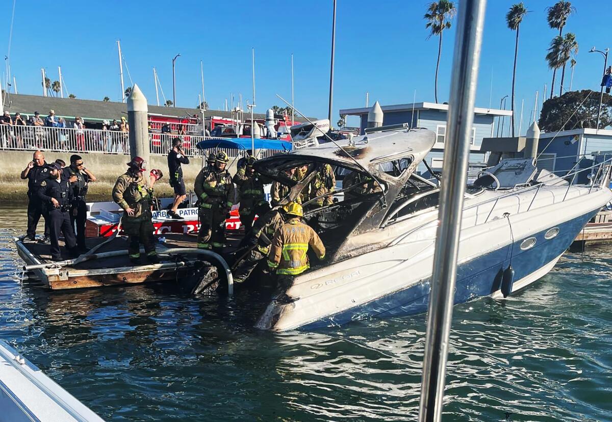 Long Beach Fire Department works a boat fire in Alamitos Bay.