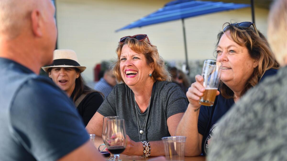 Customers sit outside the Brouwerij West in San Pedro on a Friday afternoon.