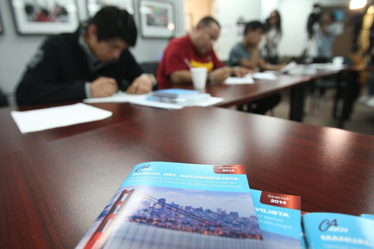 During a driver's license test preparation class at the Coalition for Humane Immigrant Rights of Los Angeles in November, students take a practice test. Immigrants in the country illegally can start applying for driver's licenses Jan. 1.