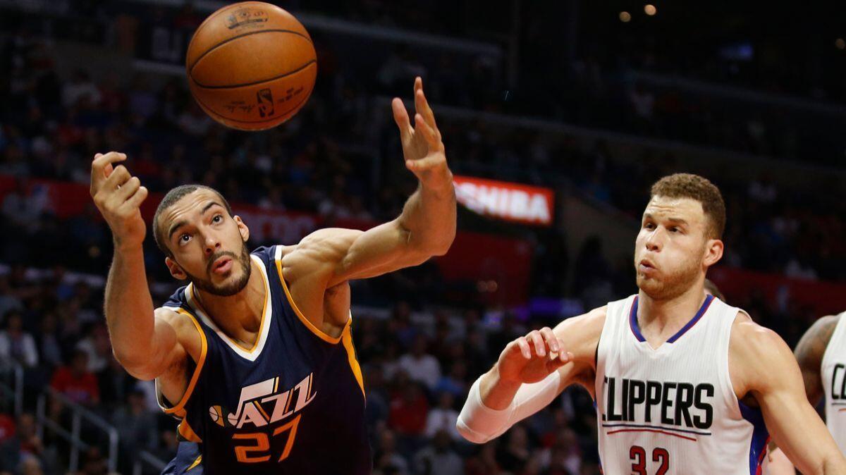 Utah Jazz center Rudy Gobert, left, reaches for a rebound in front of Clippers forward Blake Griffin during the first half on March 25.