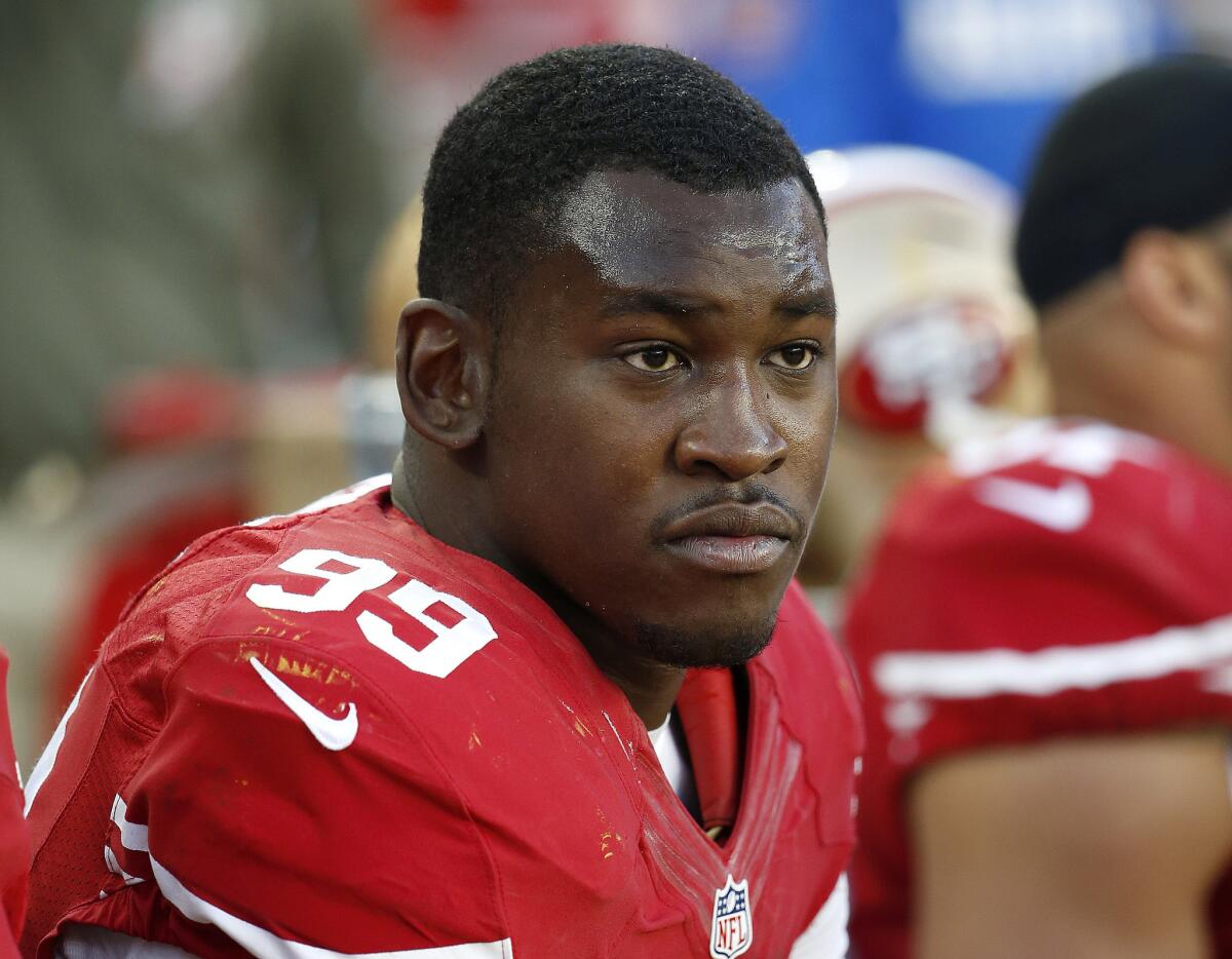 Linebacker Aldon Smith, with the 49ers last season, sits on the bench during the second half of a game against the Redskins.