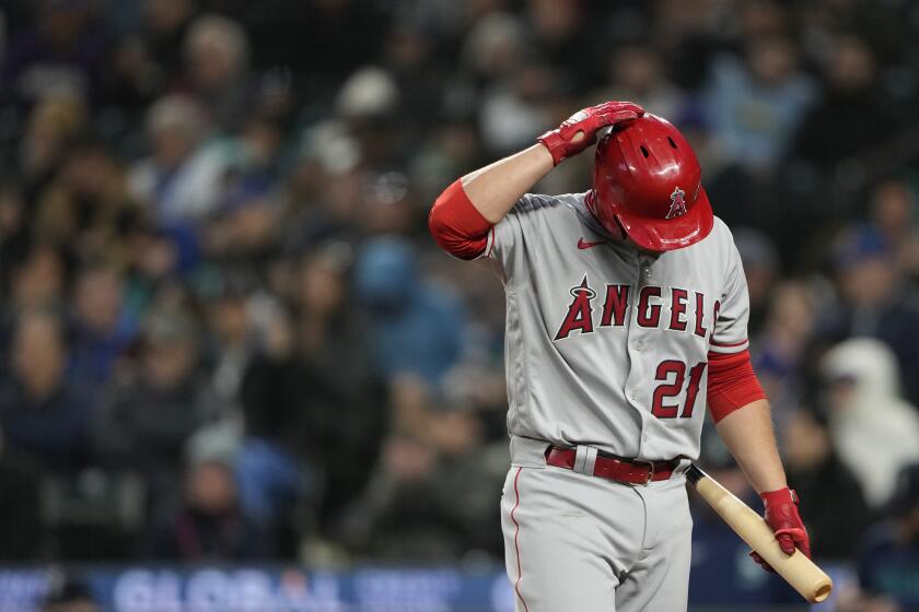 Los Angeles Angels' Matt Thaiss walks away after striking out against Seattle Mariners starting pitcher Luis Castillo during the fifth inning of a baseball game Tuesday, April 4, 2023, in Seattle. (AP Photo/Lindsey Wasson)