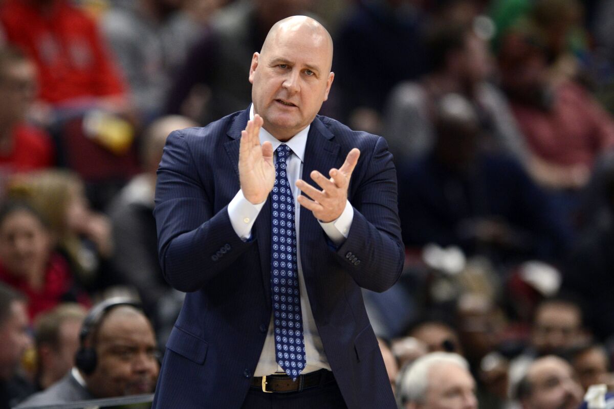 FILE - In this March 10, 2020, file photo, Chicago Bulls coach Jim Boylen cheers on players during the first half of the team's NBA basketball game against the Cleveland Cavaliers in Chicago. Boylen will remain as coach for USA Basketball for the next window of World Cup qualifying, coming up later this month with games against Uruguay and Colombia. (AP Photo/Paul Beaty, File)