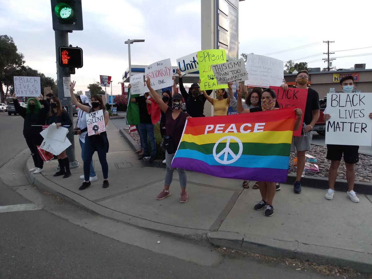 Demonstrators gather in Ramona on June 2 to protest racial inequalities and police violence against black people.