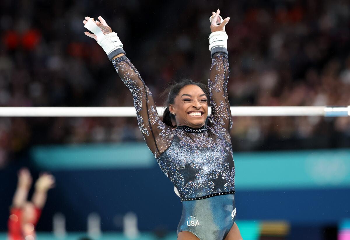 U.S. gymnast Simone Biles smiles after her uneven bars routine during qualifications Sunday.