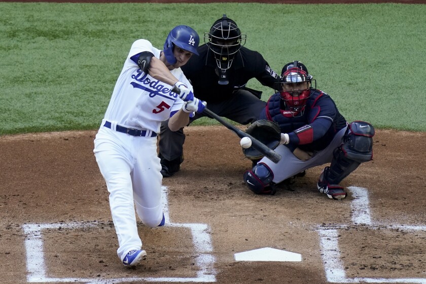 Los Angeles Dodgers' Corey Seager watches his home run against the Atlanta Braves.