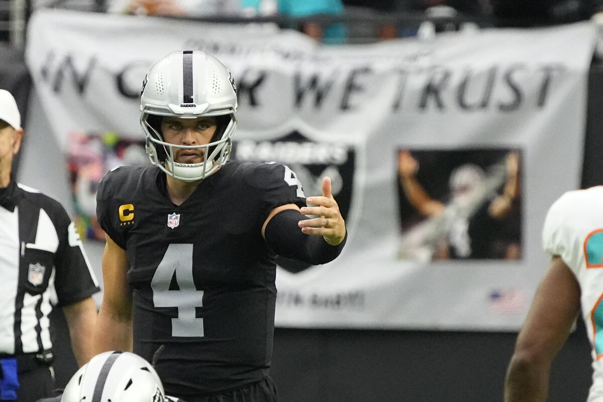 Las Vegas Raiders quarterback Derek Carr prepares to take a snap against the Miami Dolphins on Sept. 26.