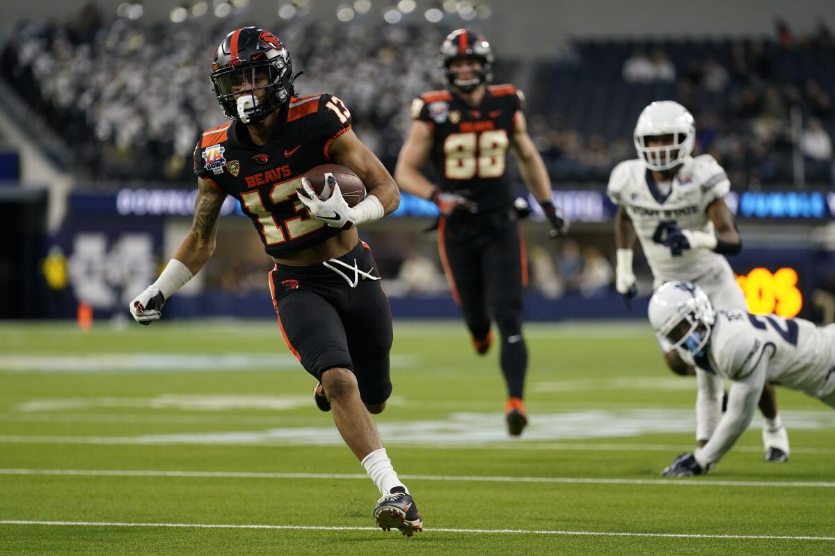 Oregon State wide receiver Jesiah Irish scampers to the end zone for a touchdown during the first half.