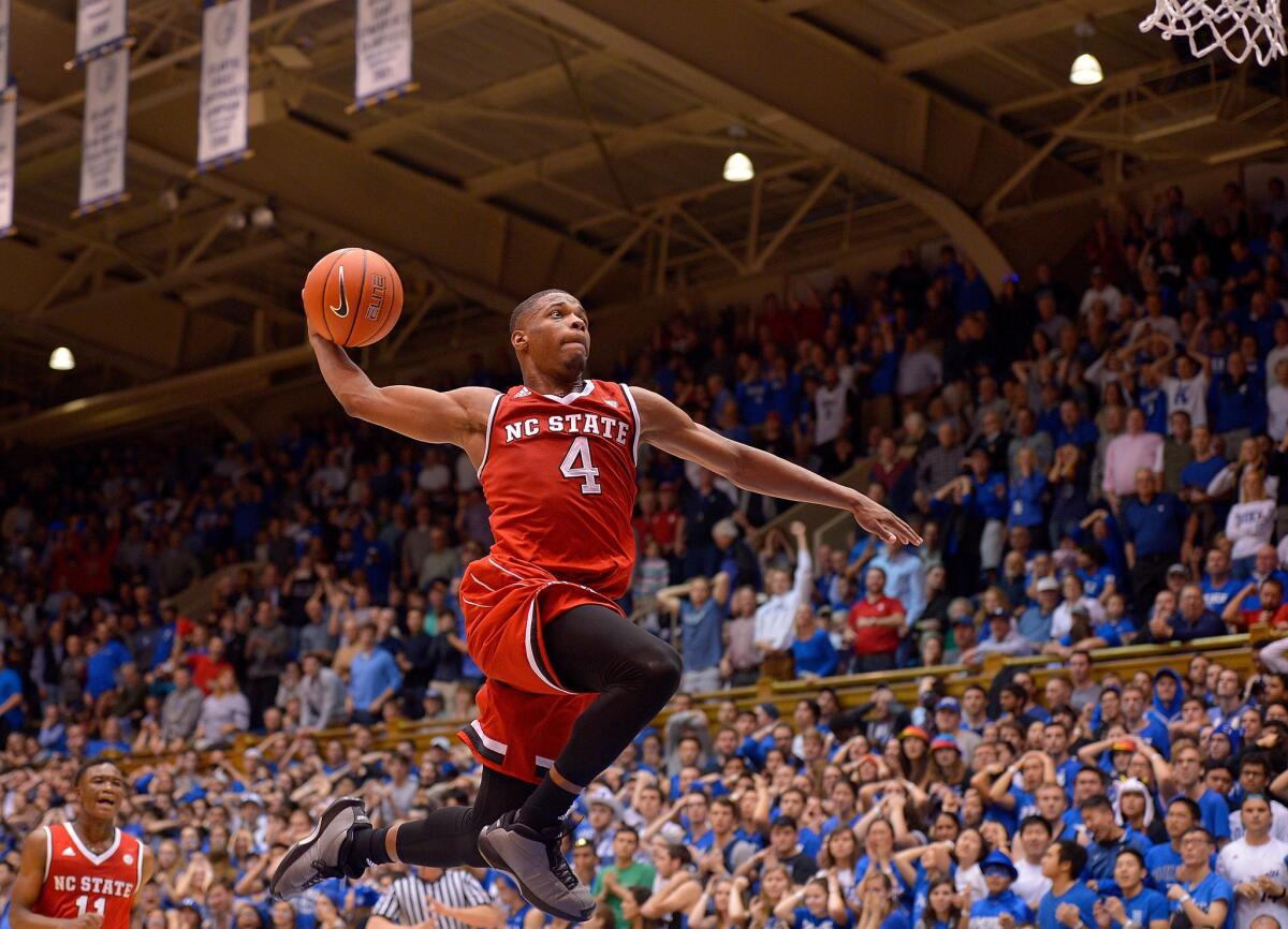 North Carolina State guard Dennis Smith Jr. (4) drives in for a dunk as time expires during a win against Duke at Cameron Indoor Stadium on Jan. 23.